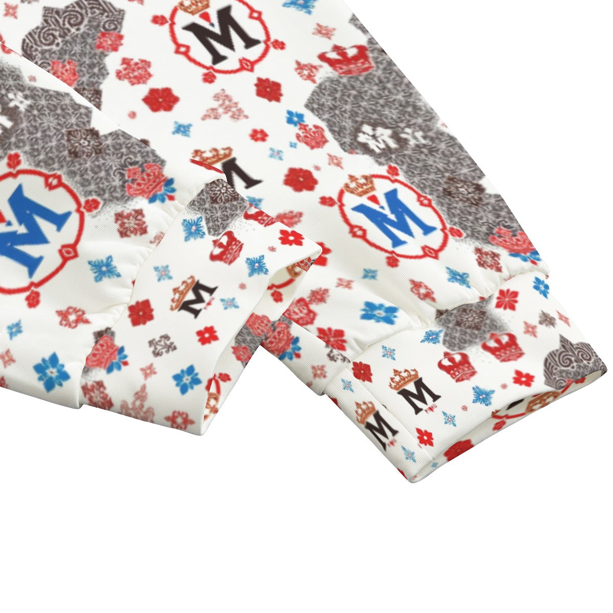 Close-up of Munsieur luxury streetwear joggers with colorful logo and crown patterns on white fabric