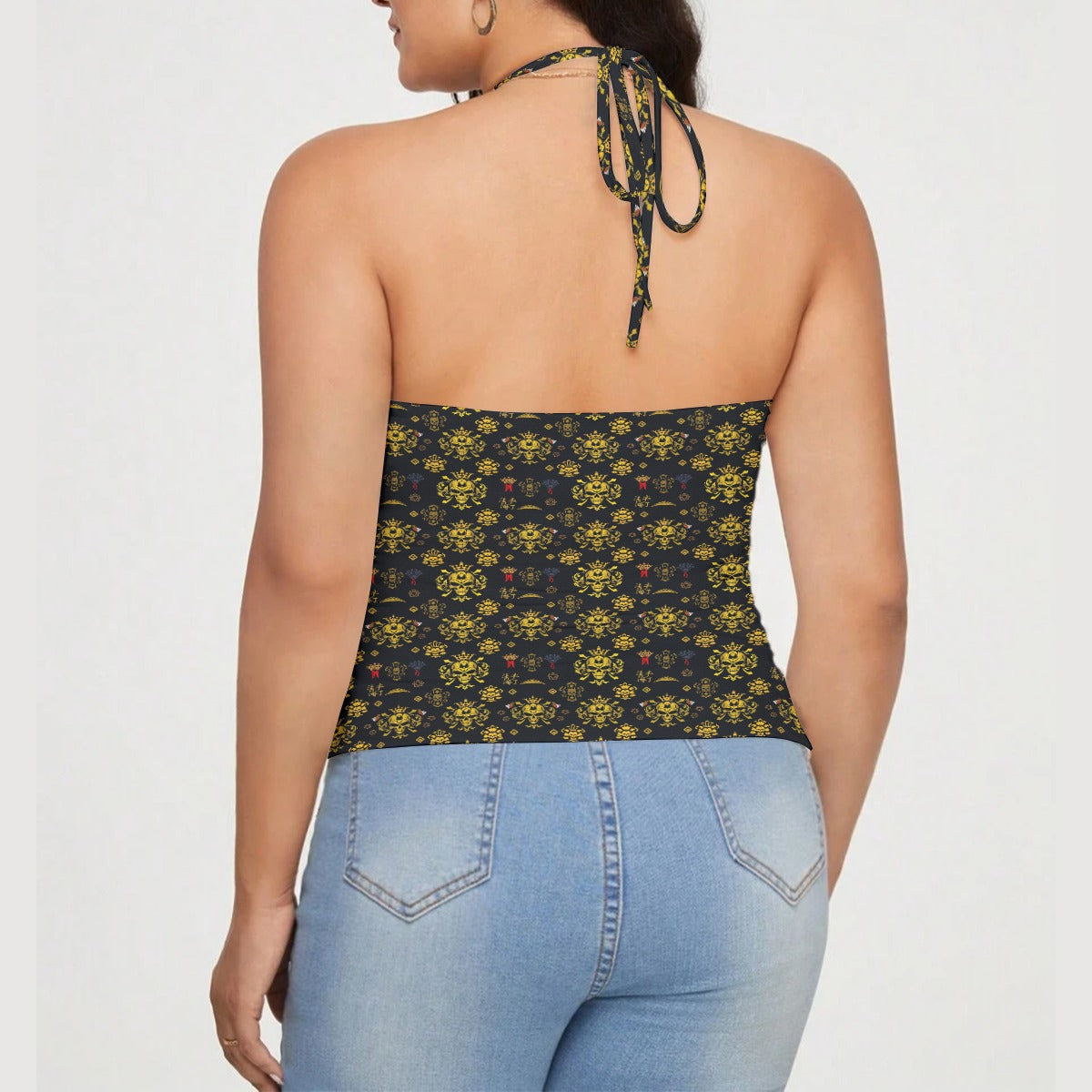 Back view of a luxury streetwear t-shirt for women with a black and yellow floral pattern and halter neck style