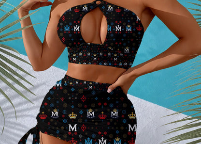 Black patterned two-piece swimsuit with palm leaves on a blue and white background