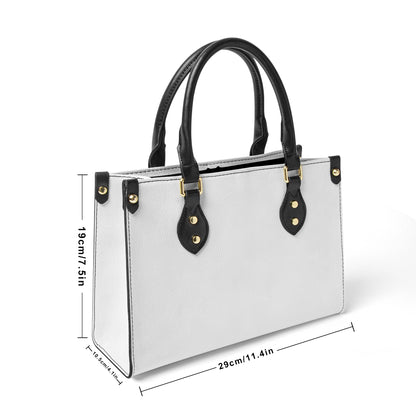 Munsieur zip pocket fashion handbag in white with black handles and gold hardware detailing