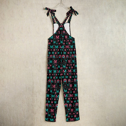 Luxury designer women's jumpsuit by Munsieur with multicolor M pattern and shoulder tie straps