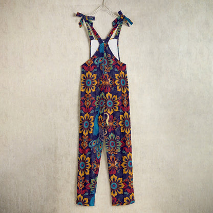 Luxury printed jumpsuit sale by Munsieur with vibrant floral and peacock design and adjustable shoulder ties