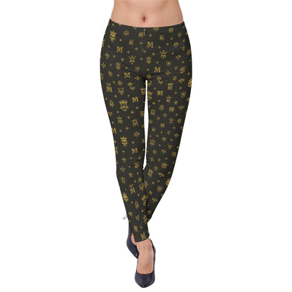 Munsieur luxury streetwear leggings with black and gold monogram pattern styled with black heels