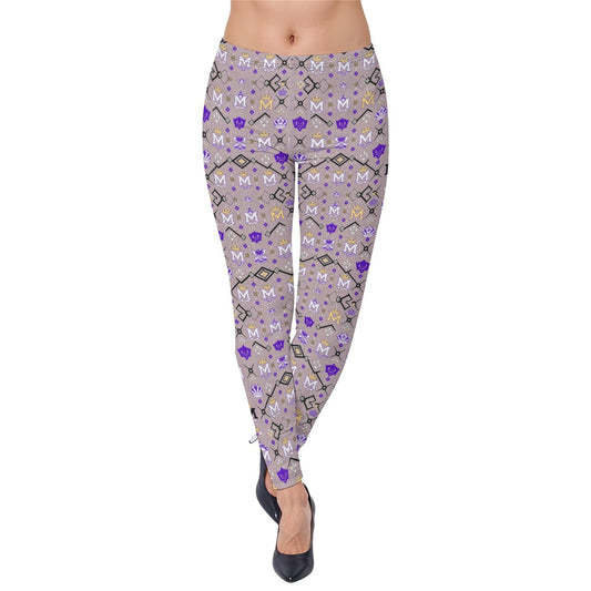 Munsieur urban luxury leggings with purple and gold geometric pattern worn with black heels